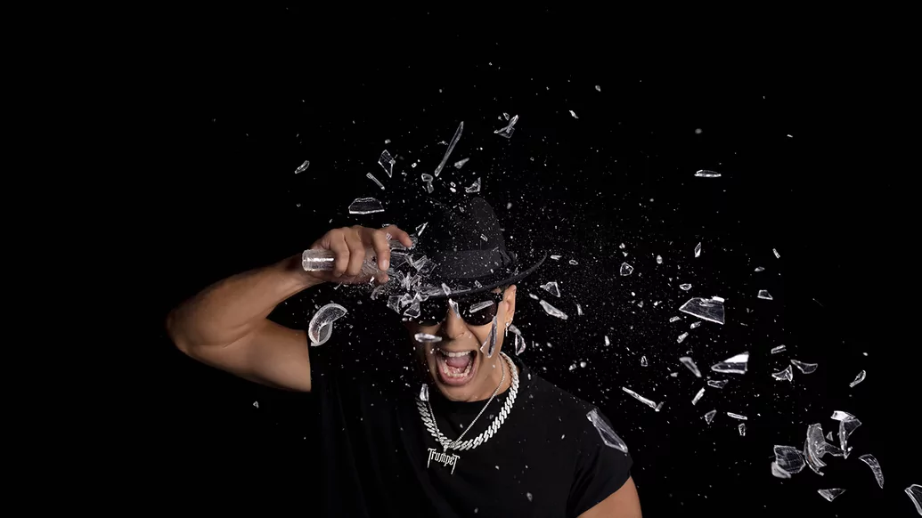 Timmy Trumpet smashing a bottle off his head
