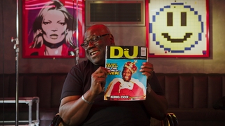 Photo of Carl Cox holding an old copy of DJ Mag in the new Top 100 DJs documentary