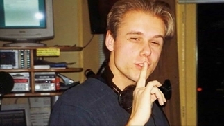 Armin Van Buuren in 1997, in the studio, holding his finger in a "shush" gesture over his lips