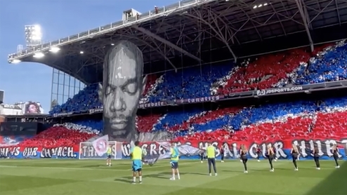 A mural of Maxi Jazz hanging from the stands at Selhurst Park
